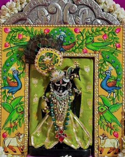 Shri Radha Girdhar Lal Ji darshan in a green shringar